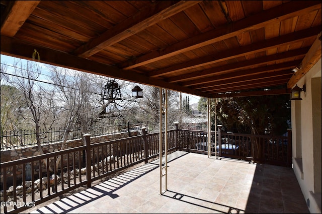 view of patio featuring fence