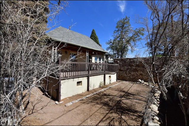 view of home's exterior with fence