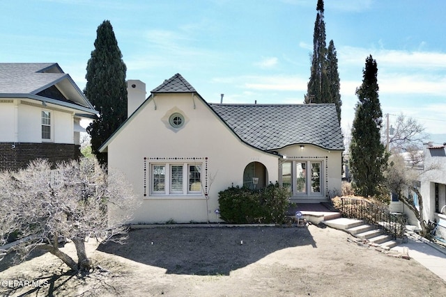 view of front facade featuring french doors and stucco siding