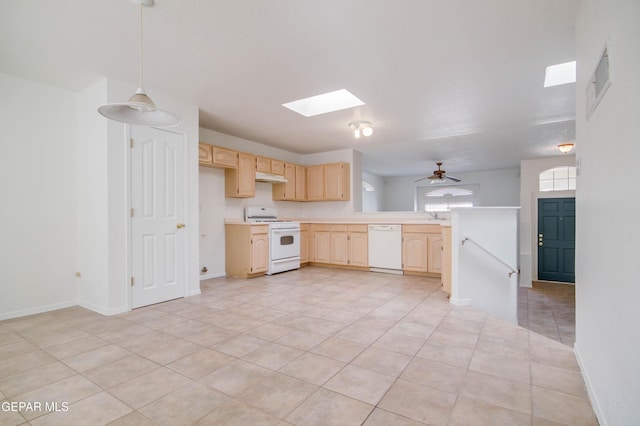 kitchen featuring light brown cabinetry, under cabinet range hood, white appliances, a skylight, and light countertops