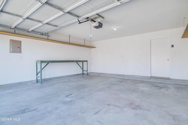 garage featuring electric panel and a garage door opener