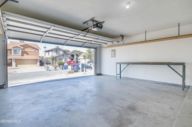 garage featuring a residential view and a garage door opener