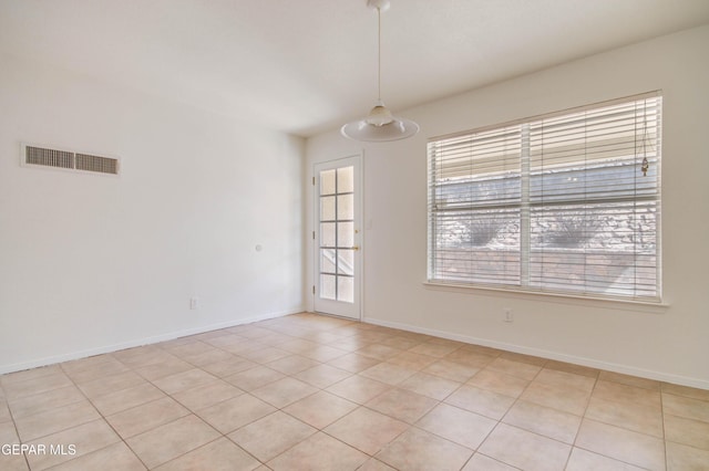 empty room with visible vents and baseboards