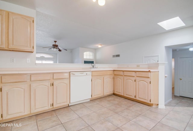 kitchen featuring dishwasher, ceiling fan, light brown cabinets, and light countertops