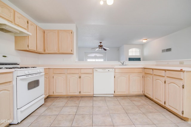 kitchen featuring white appliances, ceiling fan, a sink, light countertops, and light brown cabinetry