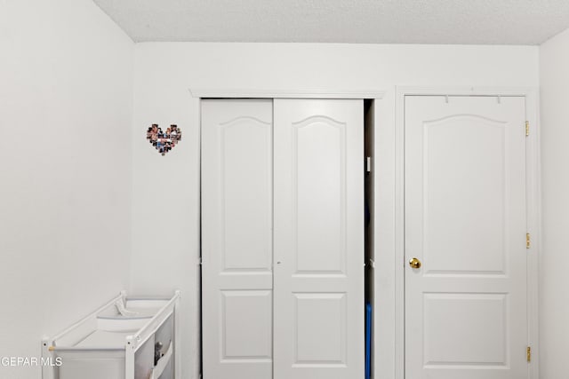 interior space with a textured ceiling