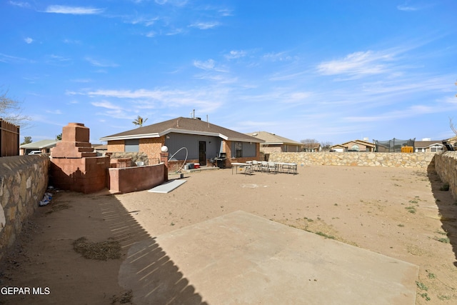 back of house with a patio area and a fenced backyard