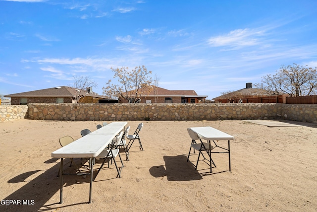 view of community with fence