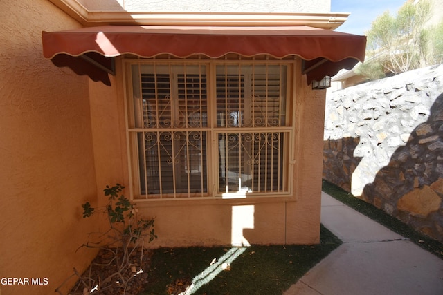 view of home's exterior with stucco siding