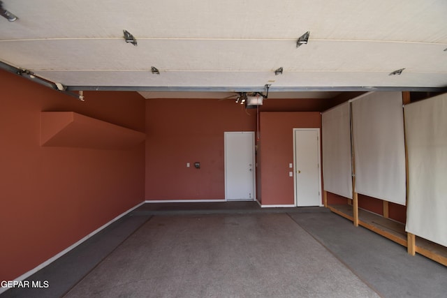 garage with baseboards and a garage door opener