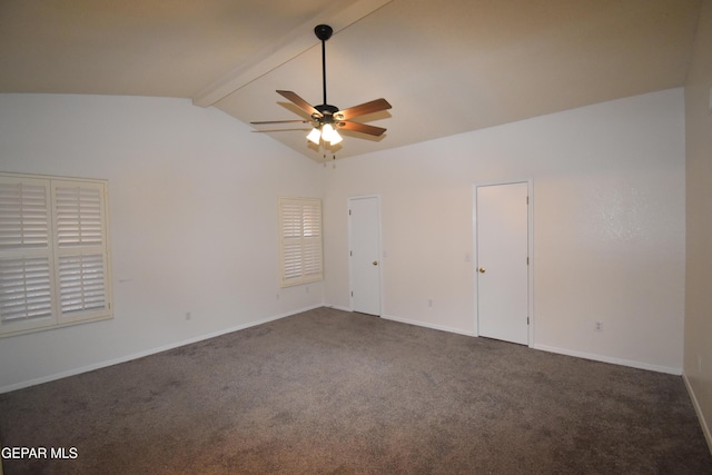 carpeted empty room featuring lofted ceiling with beams, ceiling fan, and baseboards