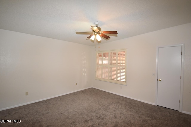 empty room featuring baseboards, a ceiling fan, and carpet flooring