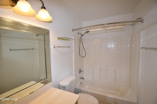 bathroom with toilet, bathing tub / shower combination, and vanity