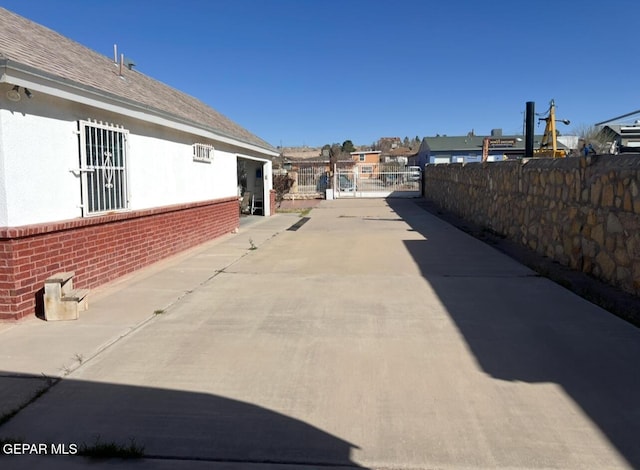 225 Peyton Rd, El Paso, TX 79928 - view of concrete driveway featuring a gated entry