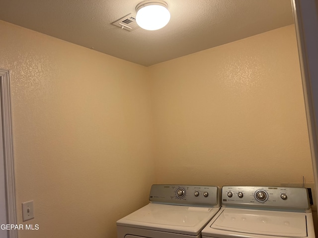 225 Peyton Rd, El Paso, TX 79928 - clothes washing area featuring washing machine and clothes dryer