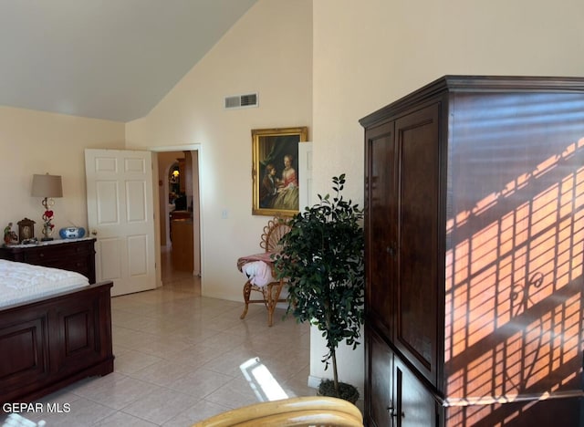225 Peyton Rd, El Paso, TX 79928 - bedroom with high vaulted ceiling, baseboards, and light tile patterned floors