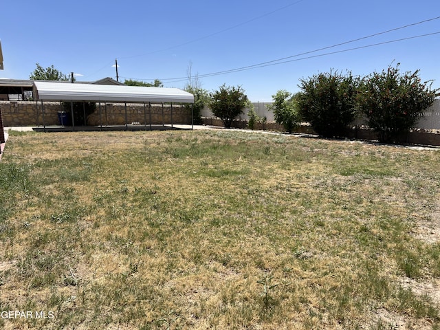 225 Peyton Rd, El Paso, TX 79928 - view of yard featuring a carport and fence
