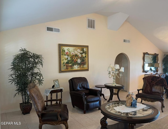 225 Peyton Rd, El Paso, TX 79928 - sitting room with high vaulted ceiling, light tile patterned floors, arched walkways, and baseboards