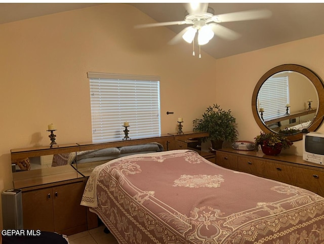 225 Peyton Rd, El Paso, TX 79928 - tiled bedroom with vaulted ceiling, multiple windows, and a ceiling fan