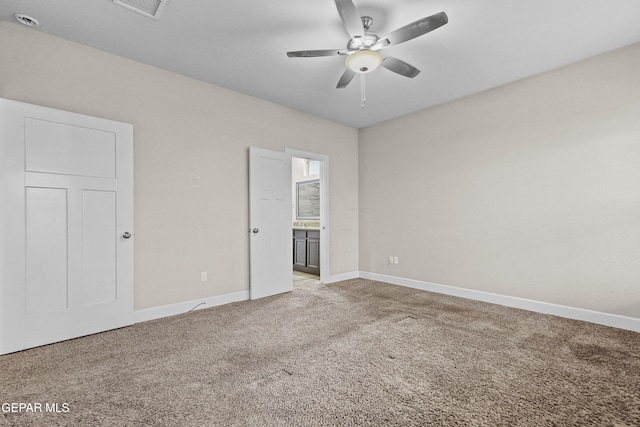 empty room with ceiling fan, baseboards, visible vents, and light colored carpet