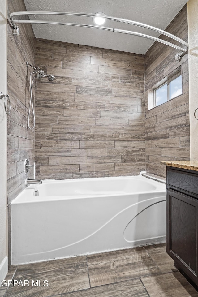 bathroom with shower / washtub combination and vanity