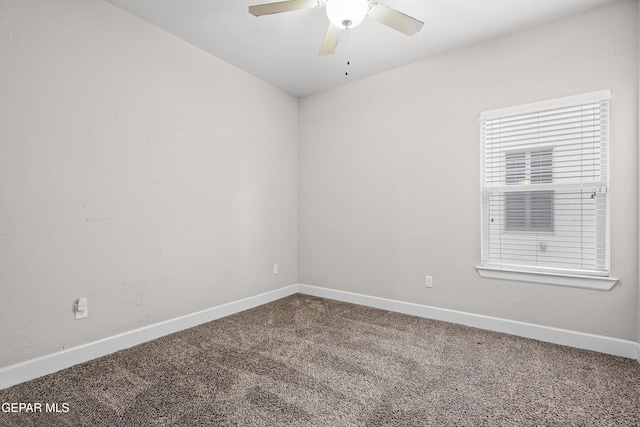 unfurnished room with carpet, baseboards, and a ceiling fan