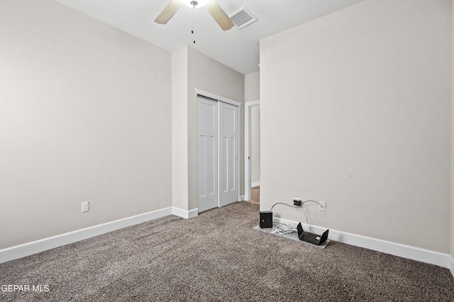 unfurnished bedroom with a closet, carpet, visible vents, and baseboards