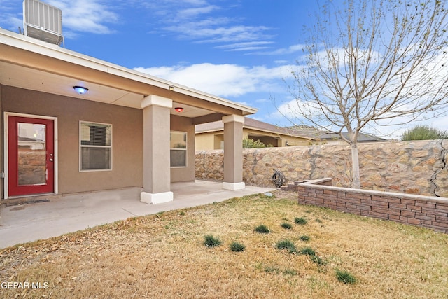 view of yard with a patio area and central AC unit