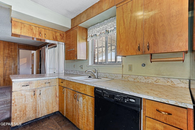 kitchen with a sink, a textured ceiling, a peninsula, light countertops, and dishwasher