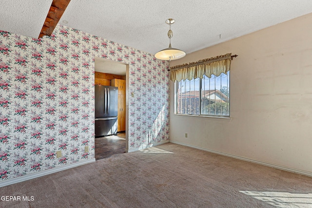 unfurnished room featuring wallpapered walls, baseboards, carpet floors, and a textured ceiling