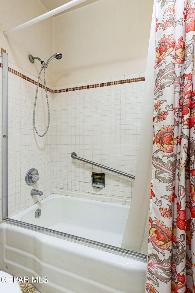 full bathroom featuring shower / tub combo with curtain