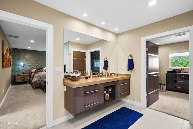 ensuite bathroom with recessed lighting, visible vents, vanity, and ensuite bathroom