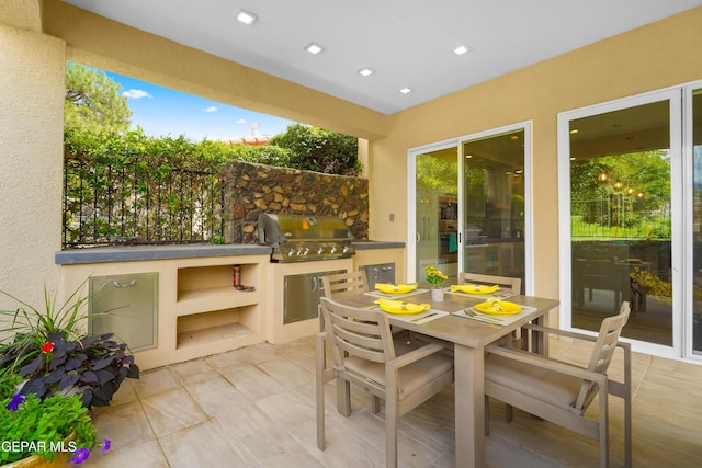 view of patio featuring outdoor dining space and area for grilling