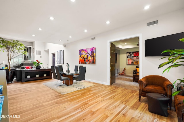 interior space with recessed lighting, baseboards, visible vents, and light wood finished floors