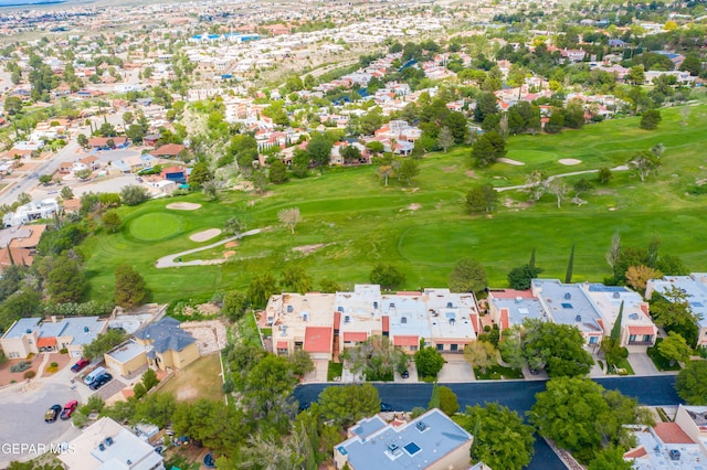 drone / aerial view with golf course view and a residential view