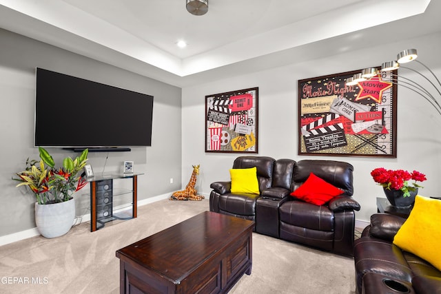 carpeted living area featuring recessed lighting and baseboards