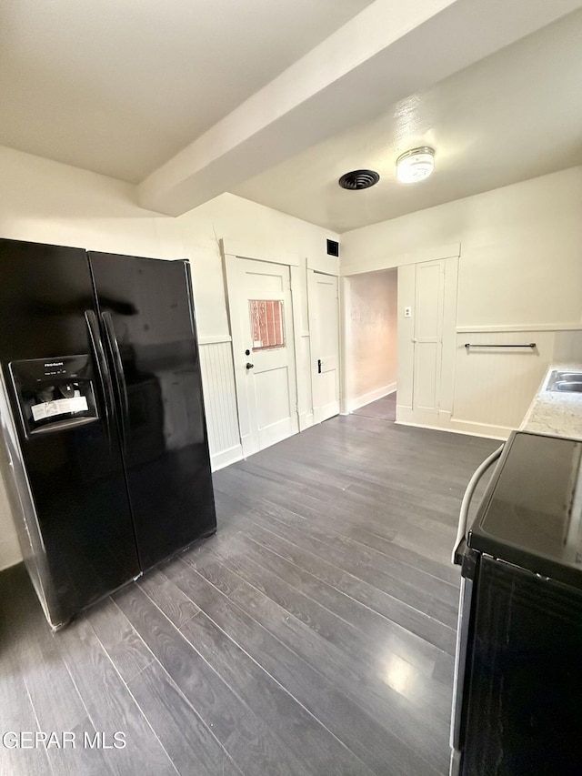 kitchen featuring electric range oven, dark wood-style flooring, a sink, and black fridge with ice dispenser