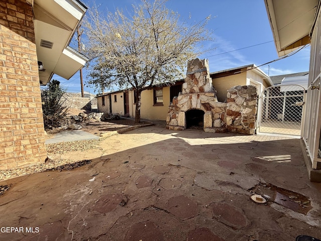 view of patio featuring a gate