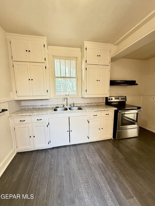 kitchen with stainless steel electric stove, dark wood-type flooring, white cabinetry, a sink, and under cabinet range hood