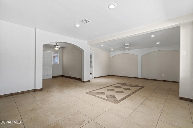 unfurnished room with arched walkways, visible vents, recessed lighting, and ceiling fan