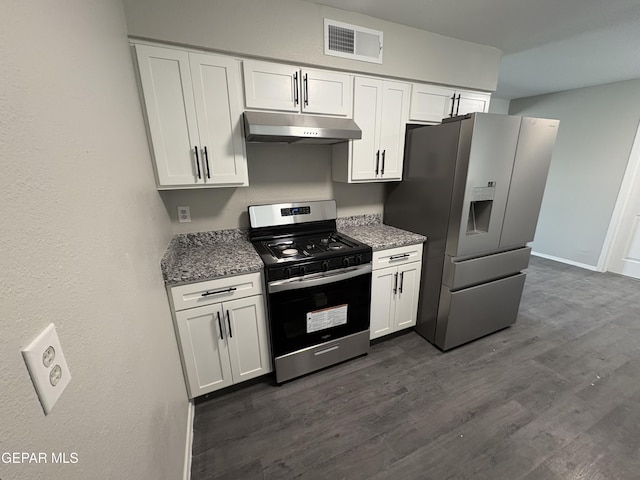 kitchen featuring stainless steel appliances, white cabinets, visible vents, and under cabinet range hood