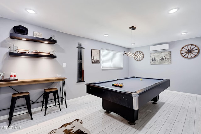 playroom featuring recessed lighting, light wood-style floors, a wall mounted air conditioner, billiards, and baseboards