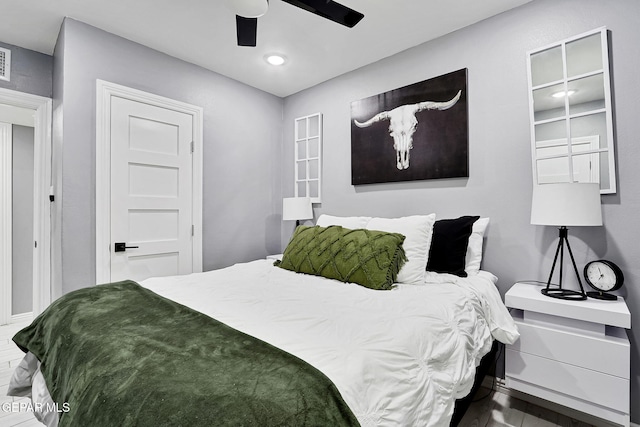 bedroom with ceiling fan and visible vents