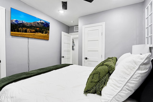 bedroom with a ceiling fan and visible vents