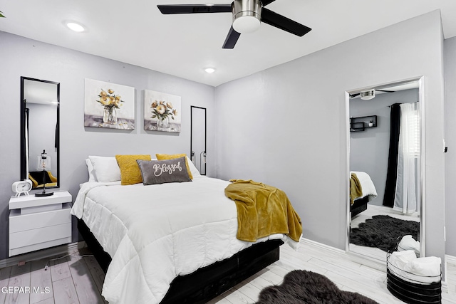 bedroom with ceiling fan, recessed lighting, wood finished floors, and baseboards