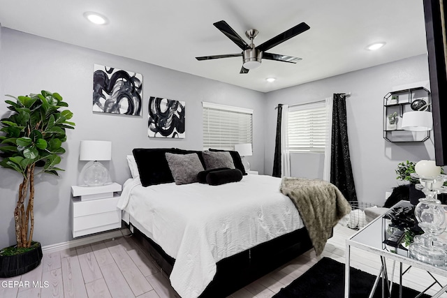 bedroom featuring ceiling fan, baseboards, wood finished floors, and recessed lighting