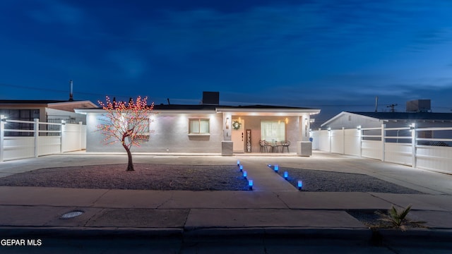 view of front facade with a porch, central AC, fence, and stucco siding