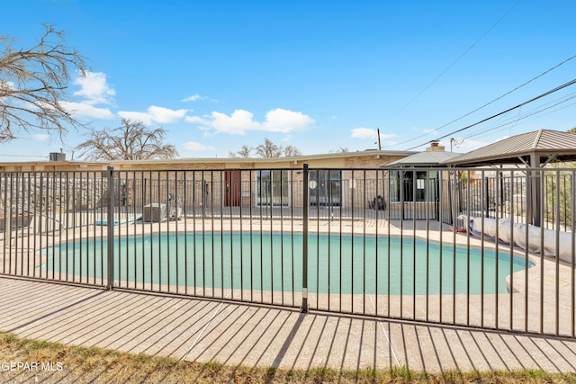 view of pool featuring a gazebo, fence, a fenced in pool, and a patio