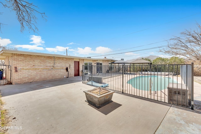 view of pool featuring a gazebo, a patio area, fence, and a fenced in pool