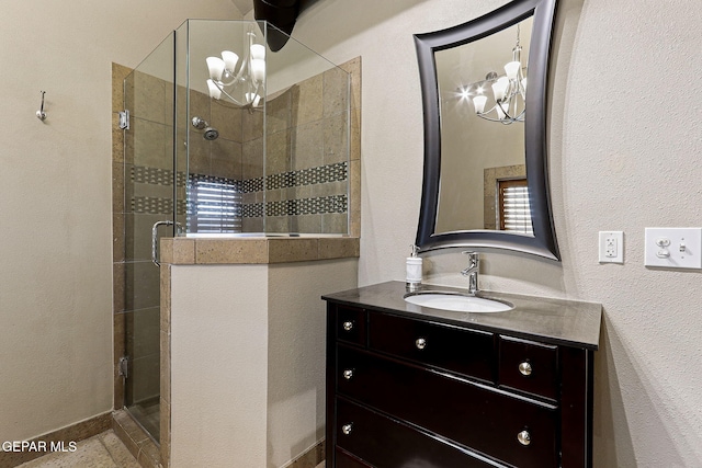 full bath featuring a stall shower and vanity